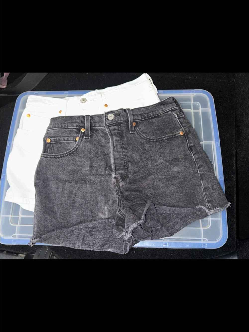 2 Levi's high-waisted Black and White Denim Cutoff Shorts in size 28